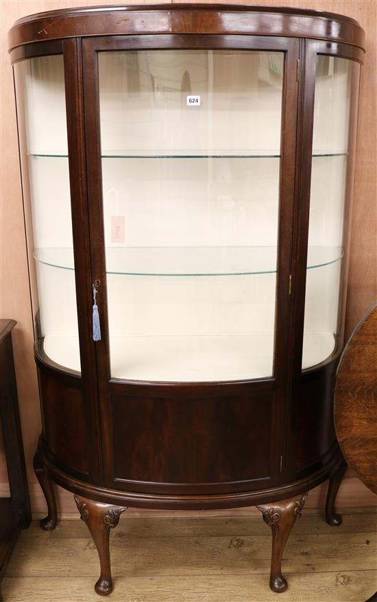 A 1920s bowfront display cabinet W.105cm